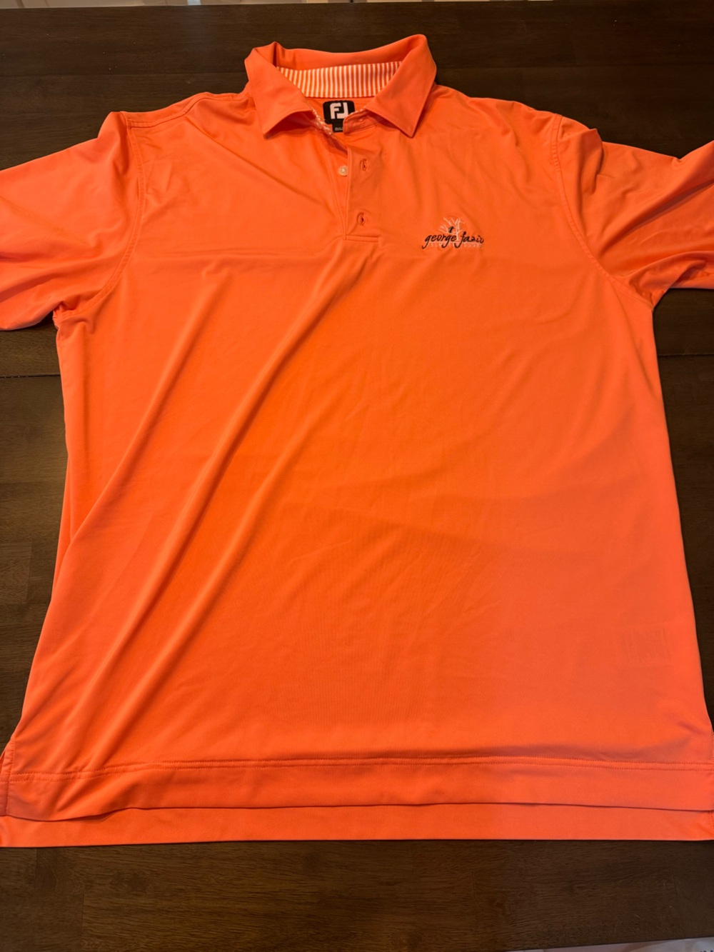 FootJoy Men's Polo Shirt - Orange coral George Fazio Palmetto dunes course